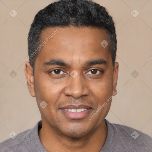 Joyful black young-adult male with short  black hair and brown eyes