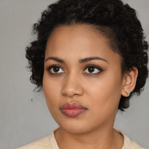 Neutral latino young-adult female with medium  black hair and brown eyes