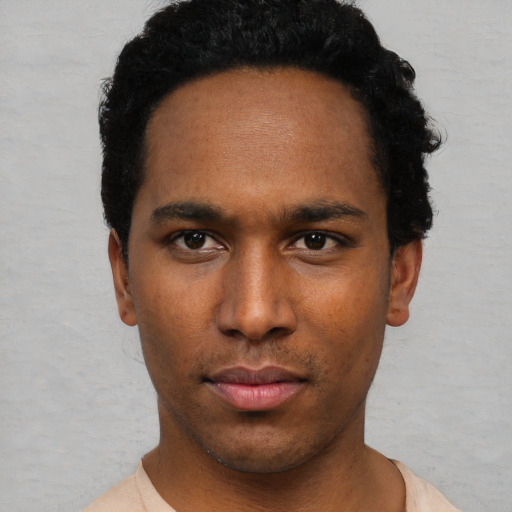 Neutral black young-adult male with short  black hair and brown eyes
