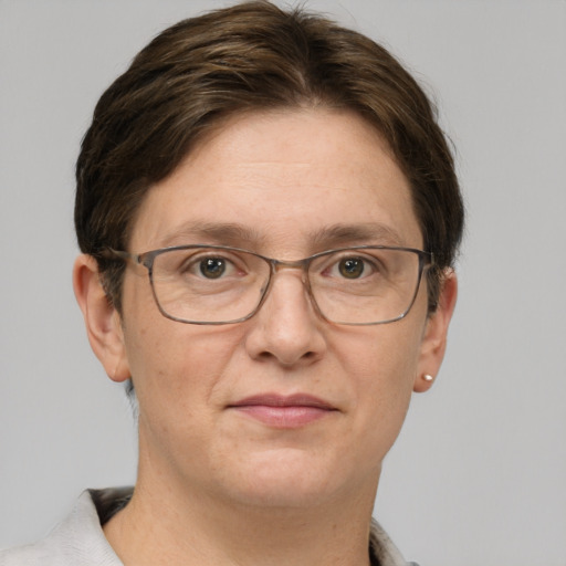 Joyful white adult female with short  brown hair and grey eyes