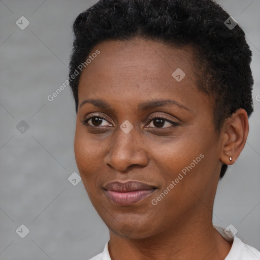 Joyful black young-adult female with short  brown hair and brown eyes