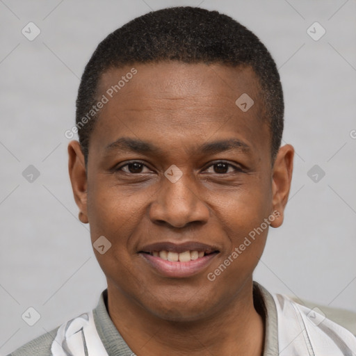 Joyful latino young-adult male with short  brown hair and brown eyes