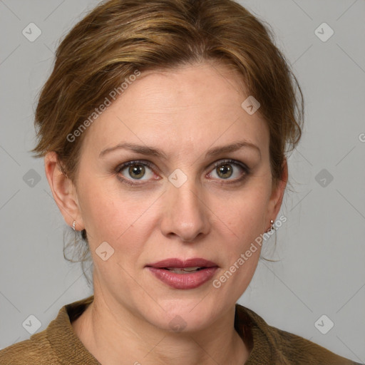 Joyful white adult female with medium  brown hair and blue eyes