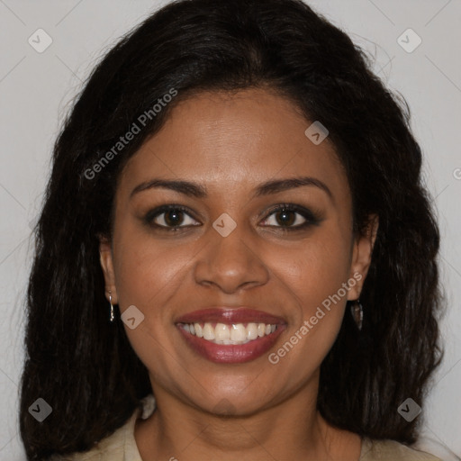 Joyful black young-adult female with long  brown hair and brown eyes