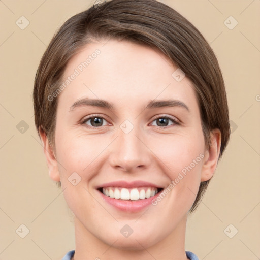 Joyful white young-adult female with short  brown hair and grey eyes