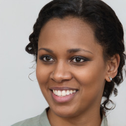 Joyful black young-adult female with medium  brown hair and brown eyes