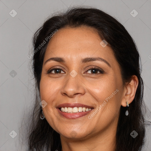 Joyful white adult female with long  brown hair and brown eyes