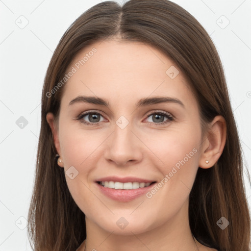 Joyful white young-adult female with long  brown hair and grey eyes