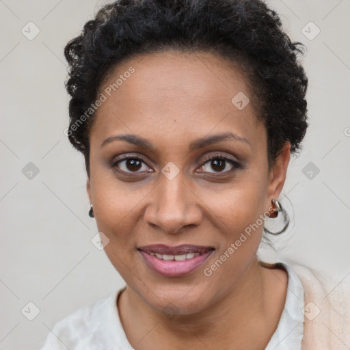 Joyful black adult female with short  brown hair and brown eyes