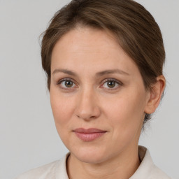 Joyful white adult female with short  brown hair and brown eyes