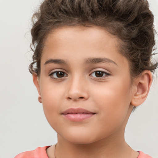 Joyful white child female with short  brown hair and brown eyes