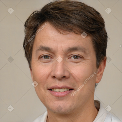 Joyful white adult male with short  brown hair and brown eyes