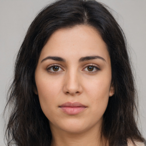 Neutral latino young-adult female with long  brown hair and brown eyes