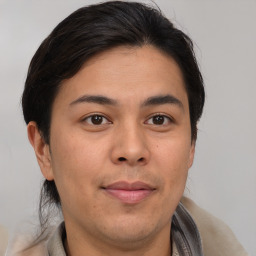 Joyful white young-adult male with medium  brown hair and brown eyes