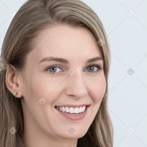 Joyful white young-adult female with long  brown hair and blue eyes