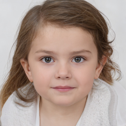 Joyful white child female with medium  brown hair and grey eyes