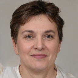 Joyful white adult female with short  brown hair and brown eyes