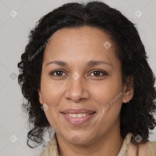 Joyful latino adult female with medium  brown hair and brown eyes