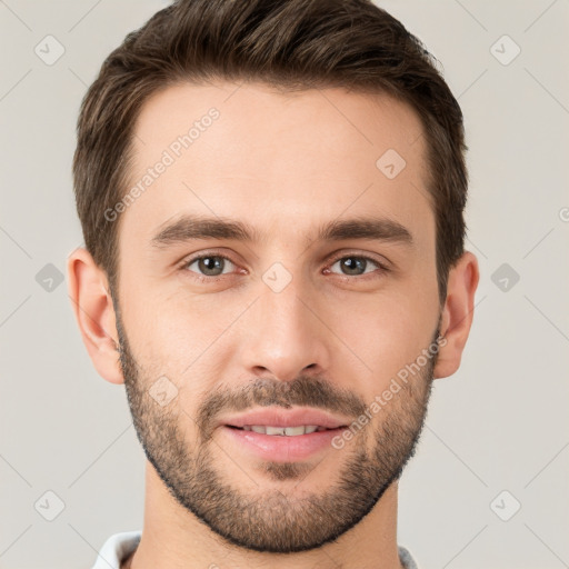 Joyful white young-adult male with short  brown hair and brown eyes