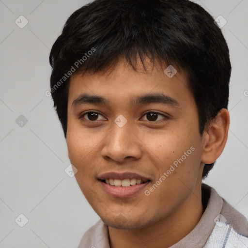 Joyful asian young-adult male with short  black hair and brown eyes