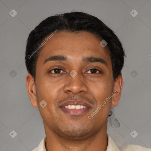 Joyful latino young-adult male with short  brown hair and brown eyes