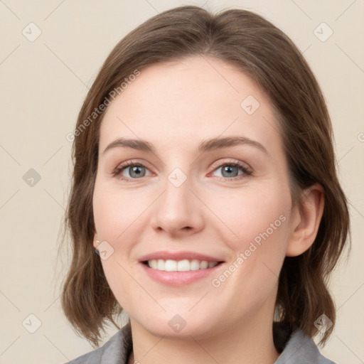 Joyful white young-adult female with medium  brown hair and green eyes