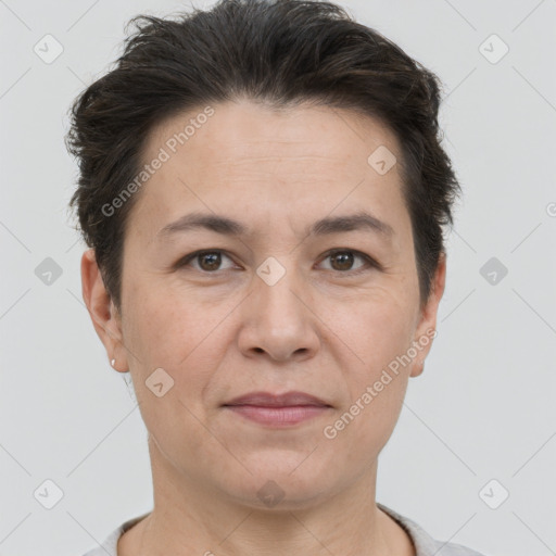 Joyful white adult female with short  brown hair and brown eyes