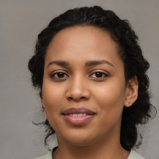 Joyful latino young-adult female with medium  black hair and brown eyes