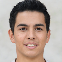 Joyful latino young-adult male with short  brown hair and brown eyes