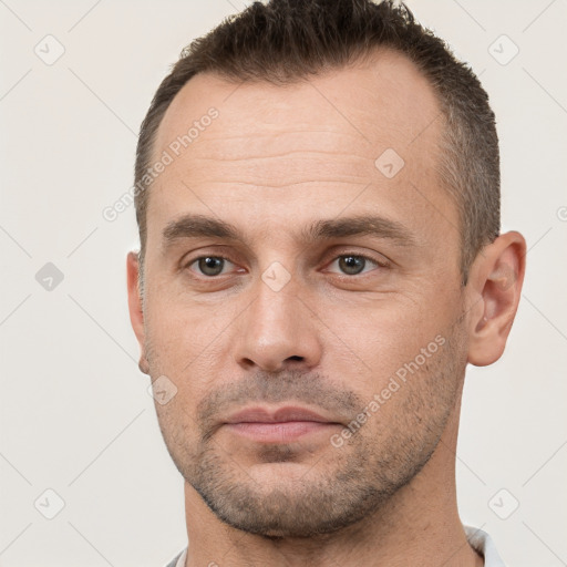 Neutral white adult male with short  brown hair and brown eyes