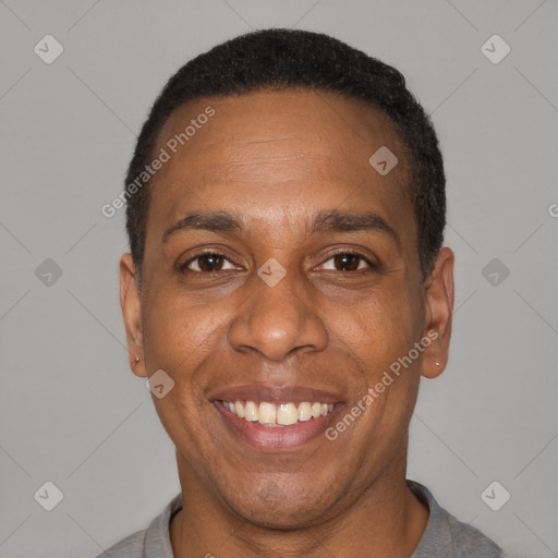 Joyful latino adult male with short  black hair and brown eyes