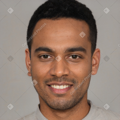 Joyful black young-adult male with short  black hair and brown eyes