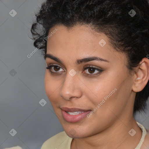 Joyful latino young-adult female with short  brown hair and brown eyes