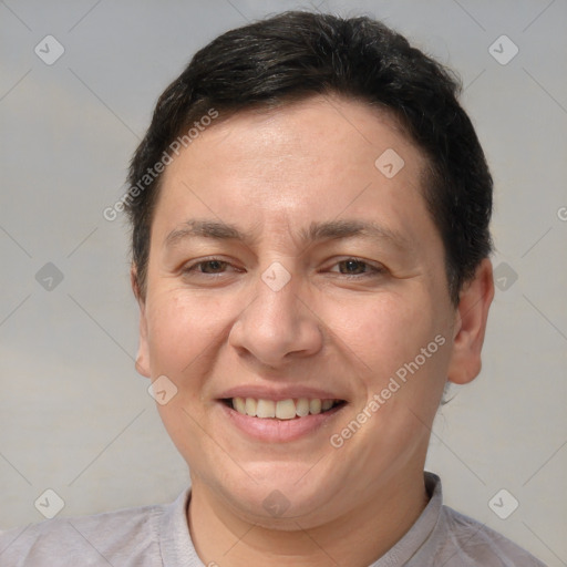 Joyful white adult female with short  brown hair and brown eyes