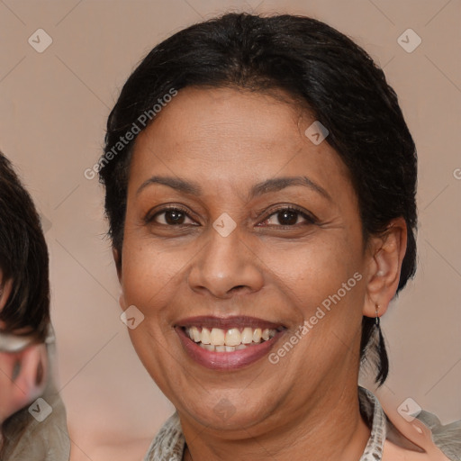 Joyful white adult female with medium  brown hair and brown eyes