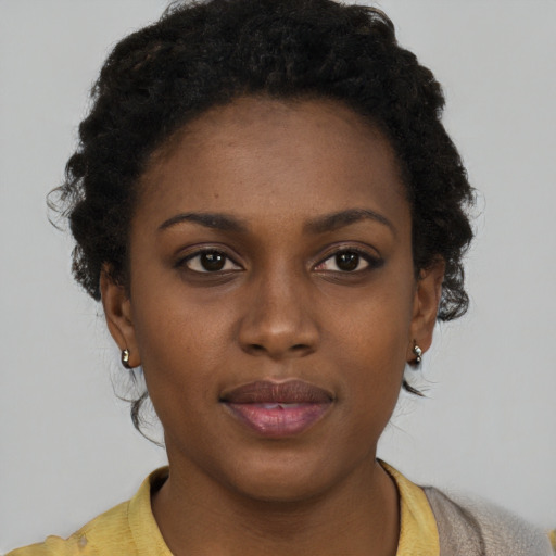 Neutral black young-adult female with short  brown hair and brown eyes