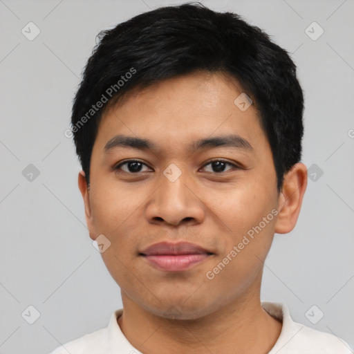 Joyful latino young-adult male with short  black hair and brown eyes