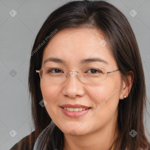 Joyful white adult female with long  brown hair and brown eyes