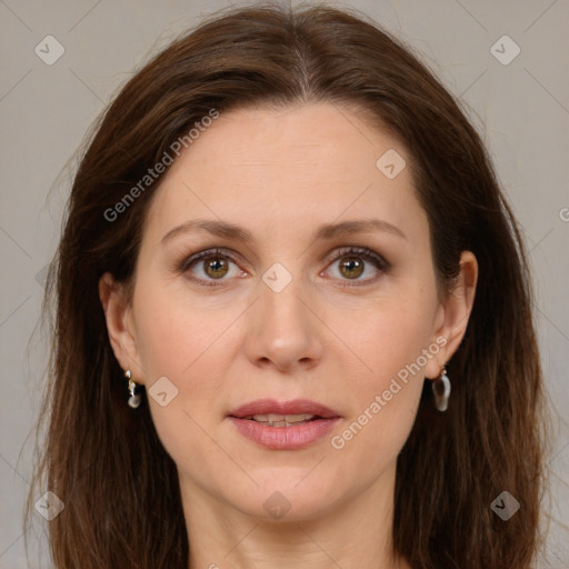 Joyful white adult female with long  brown hair and brown eyes