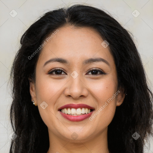 Joyful latino young-adult female with long  brown hair and brown eyes