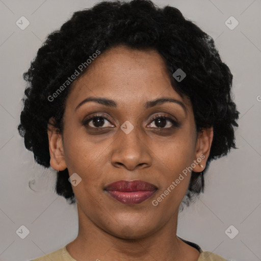 Joyful black adult female with short  brown hair and brown eyes