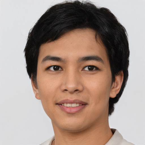Joyful asian young-adult male with short  black hair and brown eyes