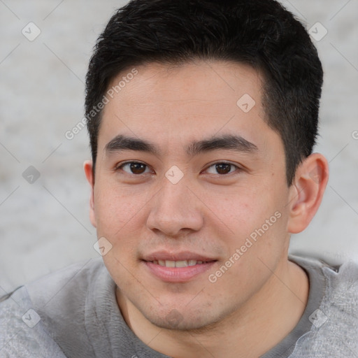 Joyful latino young-adult male with short  brown hair and brown eyes