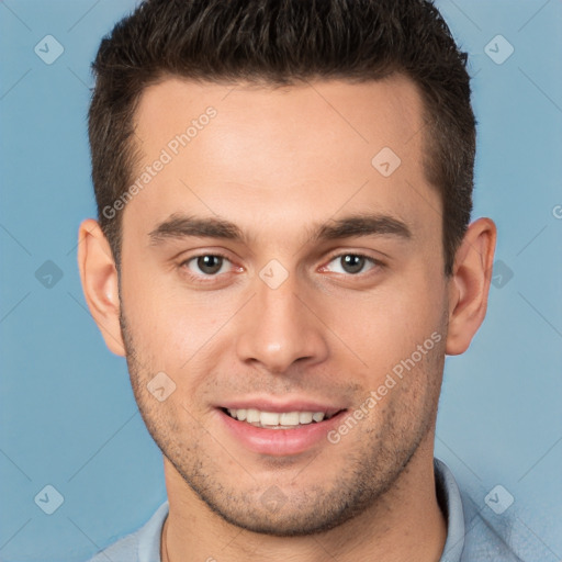 Joyful white young-adult male with short  brown hair and brown eyes