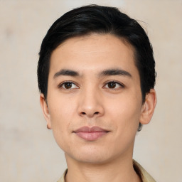 Joyful asian young-adult male with short  black hair and brown eyes