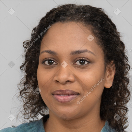 Joyful black young-adult female with medium  brown hair and brown eyes