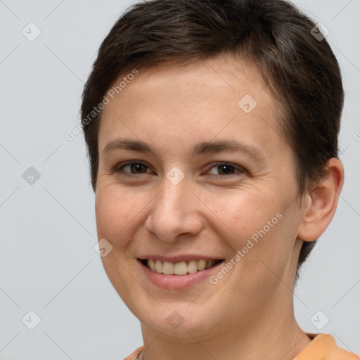 Joyful white young-adult female with short  brown hair and brown eyes