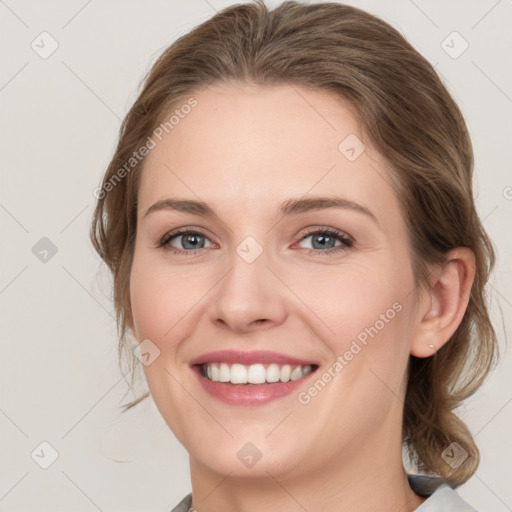 Joyful white young-adult female with medium  brown hair and grey eyes