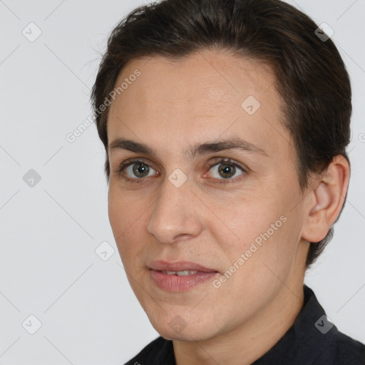 Joyful white adult female with short  brown hair and brown eyes