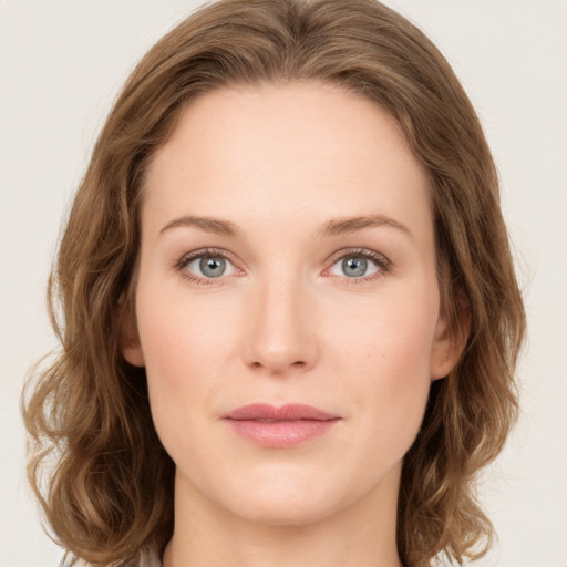 Joyful white young-adult female with medium  brown hair and green eyes